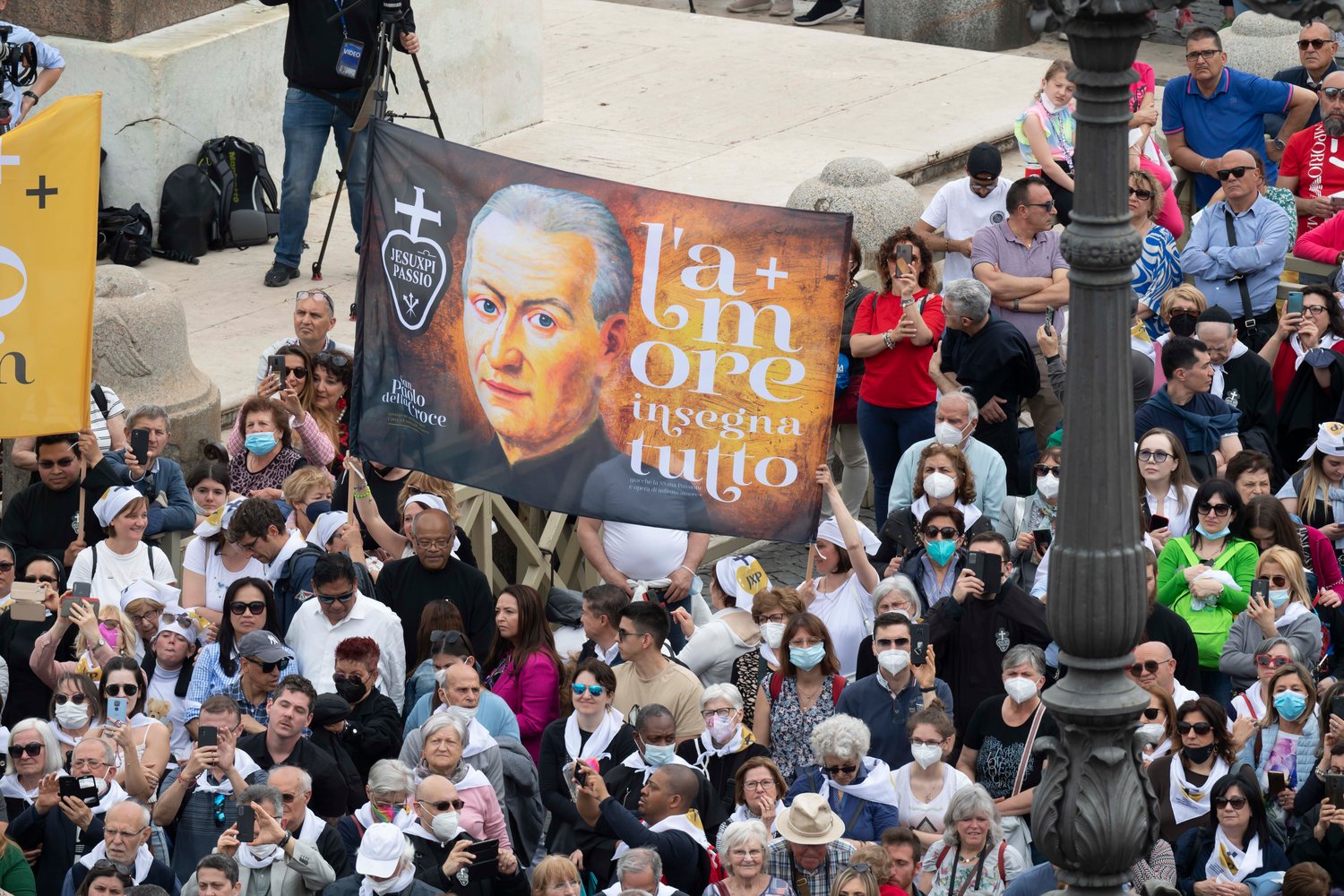 A banner showing St. Paul of the Cross, founder of the Passionists, is seen in St. Peter’s Square as Pope Francis leads the “Regina Coeli” prayer from the window of his studio overlooking the square at the Vatican May 8.
